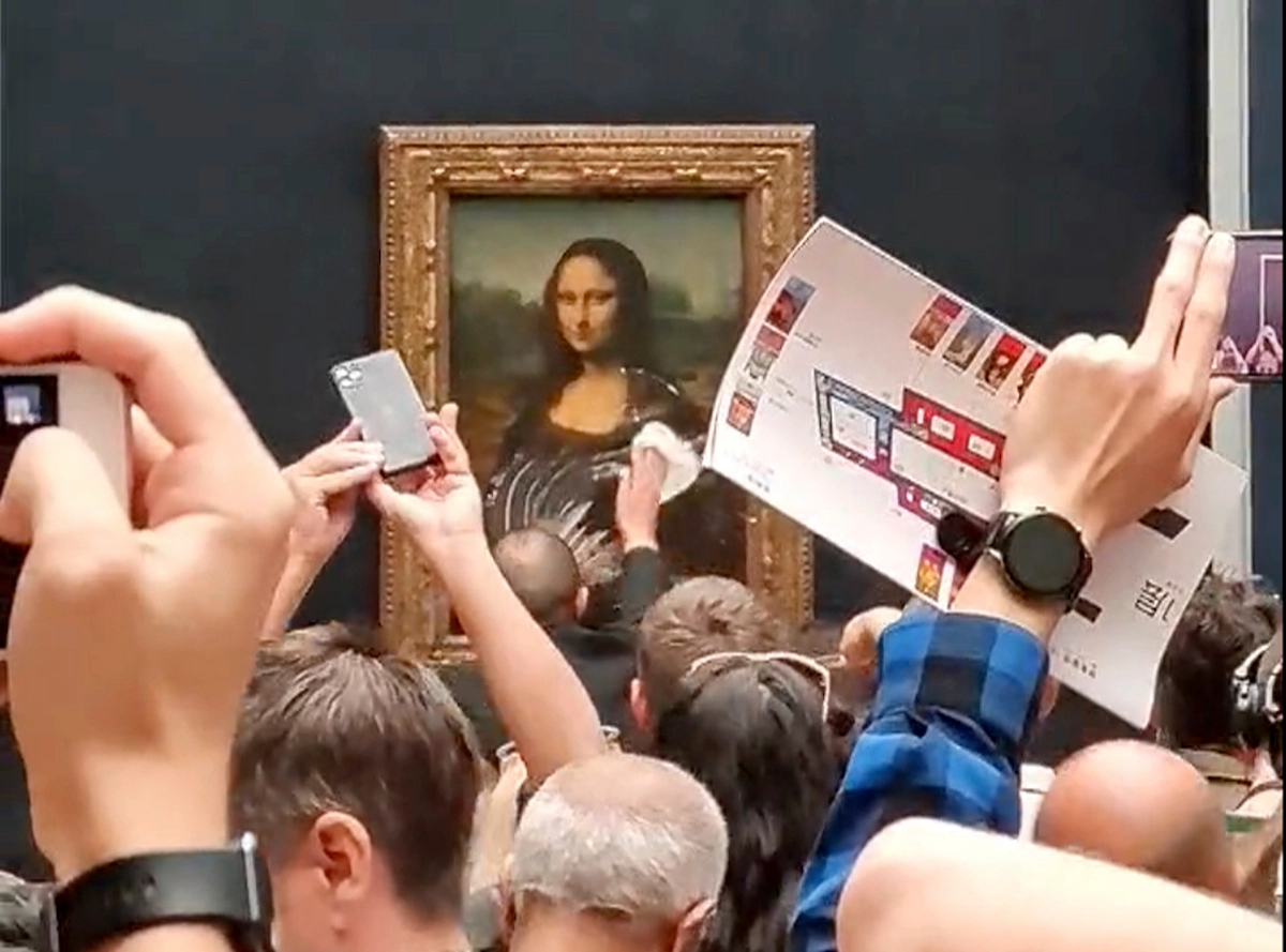 Mona Lisa Smeared with Cake by Climate Change Protester: ‘Think of thePlanet’